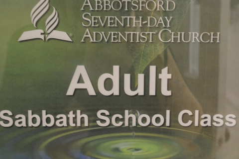 Graphic sign saying, "Adult Sabbath School Class"